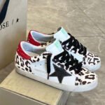 Super-Star with black matte cowhide star and red matte cowhide leather heel